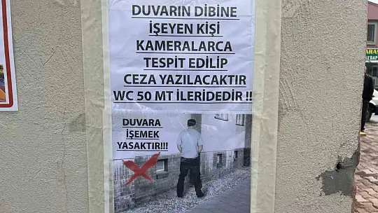 'Duvarlar tuvalet değildir' afişi